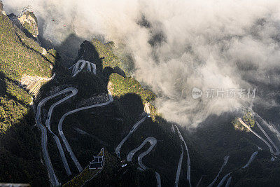 High altitude view of a long slithering curvy mountain road of Zhangjiajie (张家界), on Tianmen mountain (天门山)